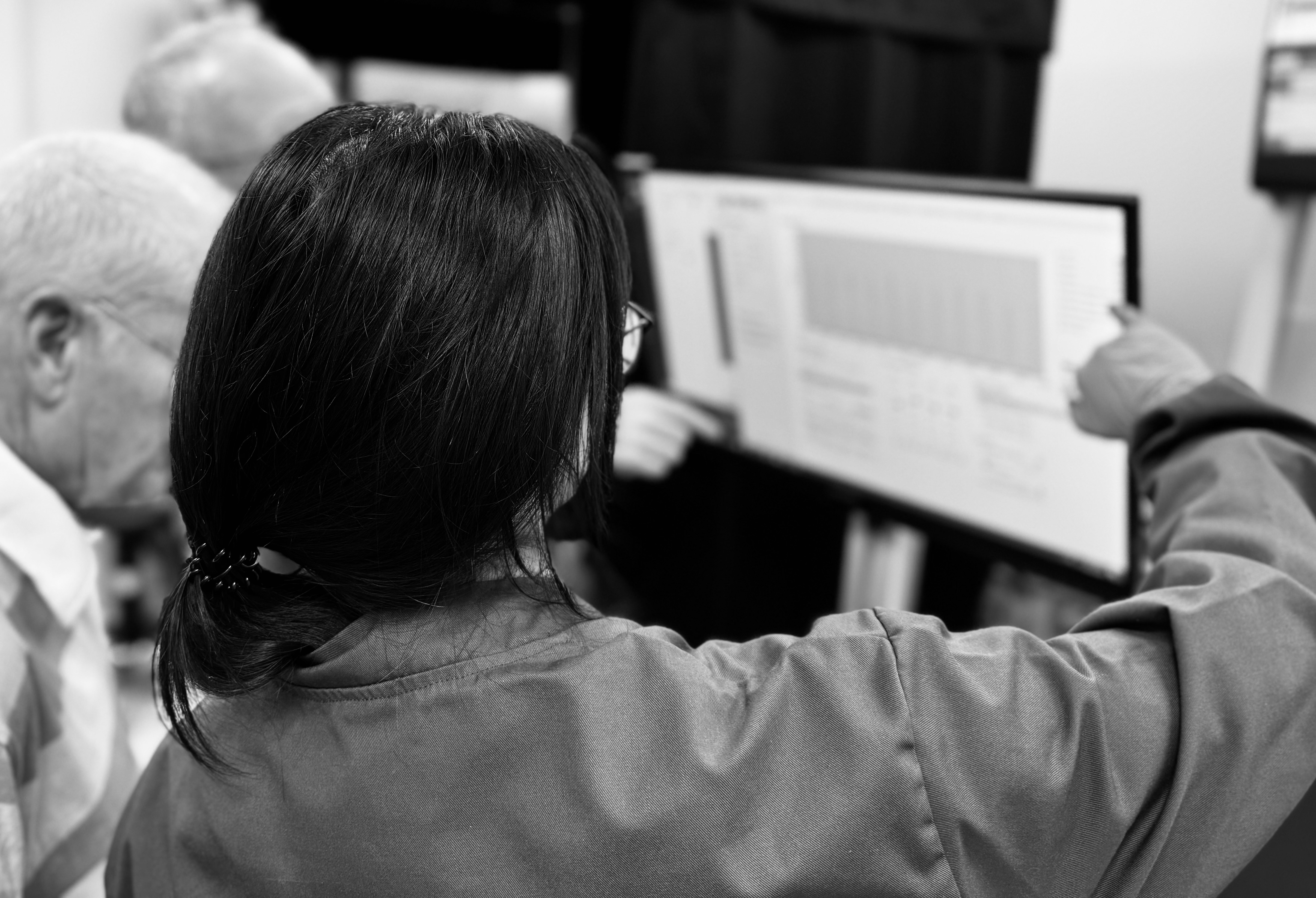 Team reviewing data on a screen